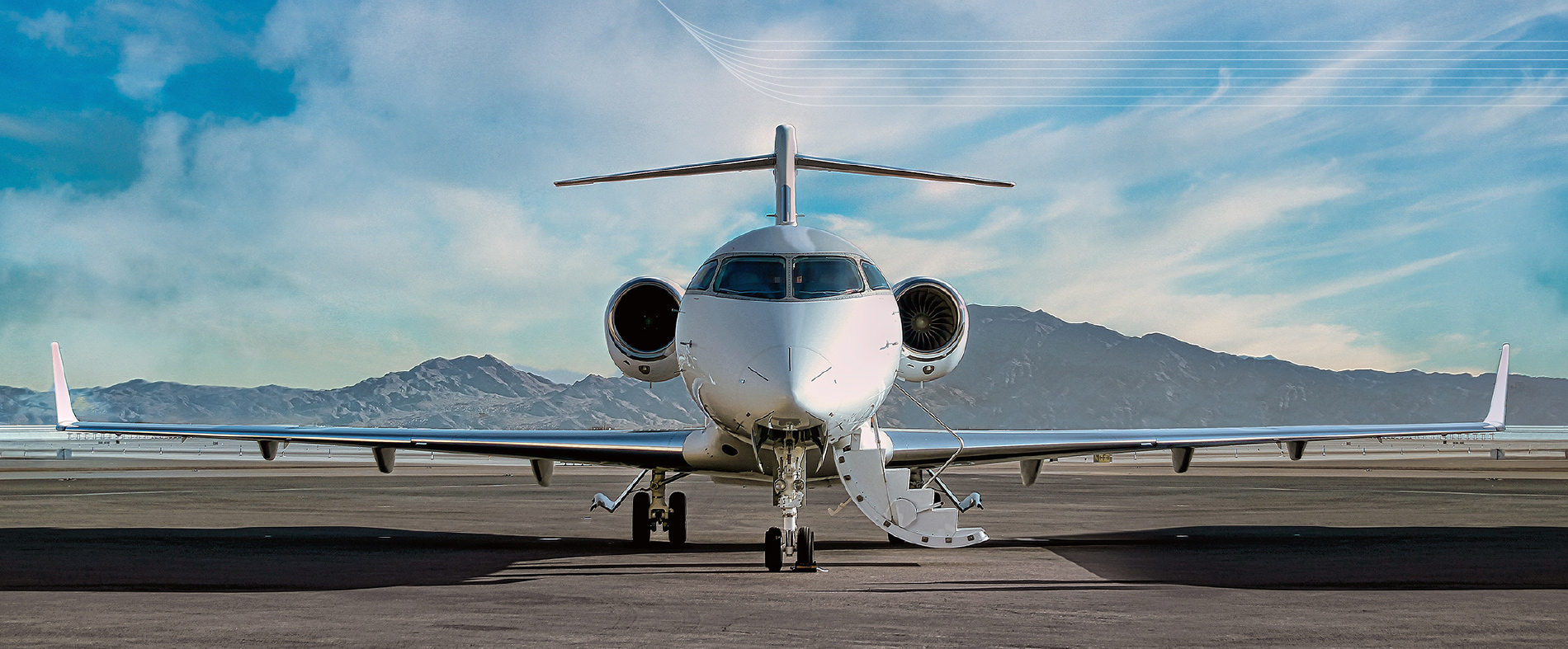photo of the front of a private aircraft on the tarmac with mountains in the background getting ready to board passengers that want to know about jetplace
