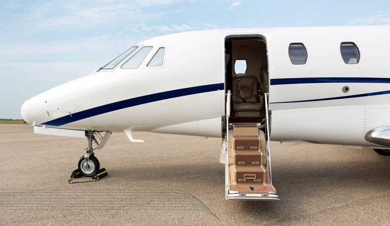 a private plane prepares to deboard passengers ready to contact jetplace