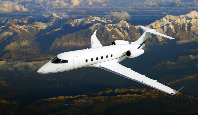 jetplace plane flying over mountains below